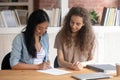 Diverse businesswomen gather in office for signing contract hiring concept