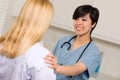 Multi-ethnic Young Female Doctor with Patient