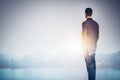 Multi exposure of young business man looking at