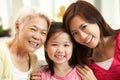 Multi Genenration Chinese Family Relaxing At Home Royalty Free Stock Photo