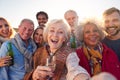 Multi-Generation Adult Family Taking Selfie At Outdoor Party Celebration