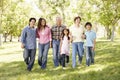 Multi-generation Asian family walking in park Royalty Free Stock Photo