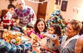 Multi generation big family having fun at christmas supper party - Winter holiday x mas concept with parents and children Royalty Free Stock Photo