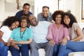 Multi generation African American  family sitting at home smiling to camera Royalty Free Stock Photo