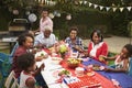 Multi generation black family at table for 4th July barbecue Royalty Free Stock Photo