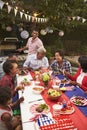 Multi generation black family at 4th July barbecue, vertical Royalty Free Stock Photo