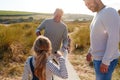 Multi-Generation Family Collecting Litter On Winter Beach Clean Up Royalty Free Stock Photo