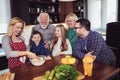 Multi Generation Family Cooking Meal At Home Royalty Free Stock Photo