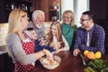 Multi Generation Family Cooking Meal At Home Royalty Free Stock Photo
