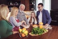 Multi Generation Family Cooking Meal At Home Royalty Free Stock Photo