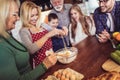 Multi Generation Family Cooking Meal At Home Royalty Free Stock Photo