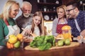 Multi Generation Family Cooking Meal At Home Royalty Free Stock Photo