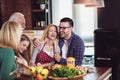 Multi Generation Family Cooking Meal At Home Royalty Free Stock Photo