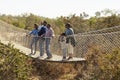 Multi Generation Family Crossing Rope Bridge Together