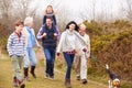 Multi Generation Family With Dog On Countryside Walk Royalty Free Stock Photo