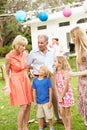 Multi Generation Family Enjoying Meal In Garden Together Royalty Free Stock Photo