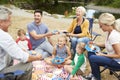 Multi Generation Family Enjoying Picnic In Countryside Royalty Free Stock Photo