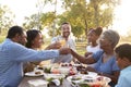 Multi Generation Family Enjoying Picnic In Park Together Royalty Free Stock Photo