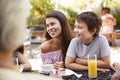 Multi Generation Family Enjoying Snack At Outdoor CafÃ¯Â¿Â½ Together Royalty Free Stock Photo