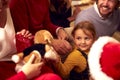 Multi-Generation Family Exchanging And Opening Gifts Around Christmas Tree At Home Royalty Free Stock Photo