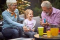 Multi generation family having fun.Grandparents playing with granddaughter