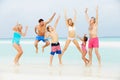 Multi Generation Family Having Fun In Sea On Beach Holiday Royalty Free Stock Photo