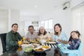 Multi generation family having a lunch together Royalty Free Stock Photo