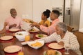 Multi-generation family having meal together Royalty Free Stock Photo