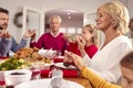 Multi Generation Family Hold Hands Around Table At Home Saying Grace Before Eating Christmas Meal Royalty Free Stock Photo