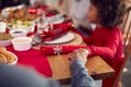 Multi Generation Family Hold Hands Around Table At Home Saying Grace Before Eating Christmas Meal Royalty Free Stock Photo