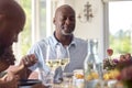 Multi Generation Family Holding Hands Around Table At Home Saying Grace Before Eating Meal Together Royalty Free Stock Photo