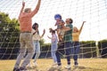 Multi-Generation Family At Home In Garden Playing Football Or Soccer Together Royalty Free Stock Photo