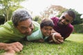 Multi generation family playing rugby at park