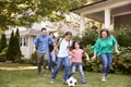 Multi Generation Family Playing Soccer In Garden Royalty Free Stock Photo