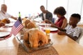 Multi-generation family praying before having meal on dining table Royalty Free Stock Photo