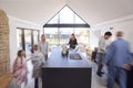 Multi-Generation Family Preparing Brunch At Home In Modern Kitchen Together Royalty Free Stock Photo