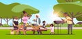 Multi generation family preparing hot dogs on grill picnic barbecue party concept summer park landscape background flat