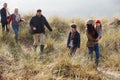 Multi Generation Family In Sand Dunes On Winter Beach Royalty Free Stock Photo