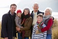 Multi Generation Family In Sand Dunes On Winter Beach Royalty Free Stock Photo