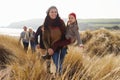 Multi Generation Family In Sand Dunes On Winter Beach Royalty Free Stock Photo