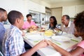 Multi-Generation Family Saying Prayer Before Eating Meal Royalty Free Stock Photo