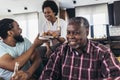 Multi generation family sitting in living room and spending time together Royalty Free Stock Photo