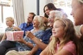 Multi-Generation Family Sitting On Sofa At Home Eating Popcorn And Watching Movie Together Royalty Free Stock Photo