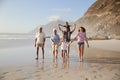 Multi Generation Family On Vacation Walking Along Beach Together Royalty Free Stock Photo