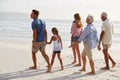 Multi Generation Family On Vacation Walking Along Beach Together Royalty Free Stock Photo