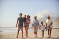 Multi Generation Family On Vacation Walking Along Beach Together Royalty Free Stock Photo
