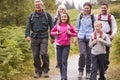 Multi generation family walking in the countryside during a camping holiday,full length Royalty Free Stock Photo