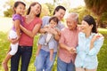 Multi Generation Family Walking In Park Together Royalty Free Stock Photo