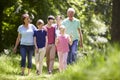 Multi Generation Family Walking Through Summer Countryside Royalty Free Stock Photo