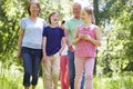 Multi Generation Family Walking Through Summer Countryside Royalty Free Stock Photo